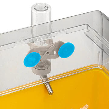 Close-up of a clear container with a valve and blue gaskets on a white background