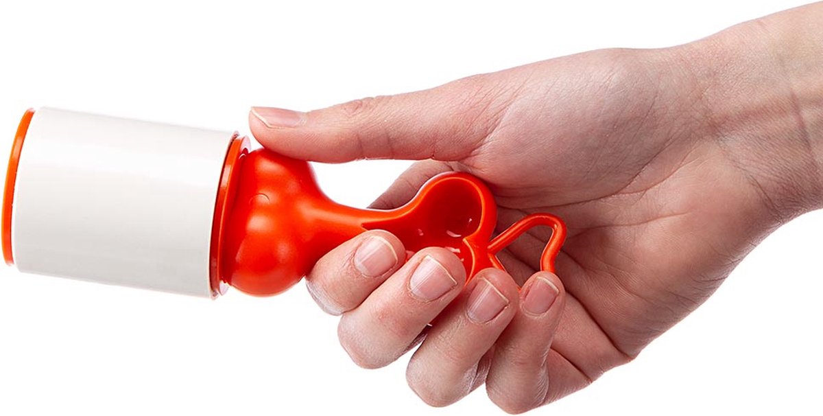 Hand holding a red and white tool against a white background