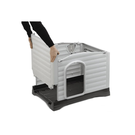 Person assembling a gray pet crate with black base on a white background