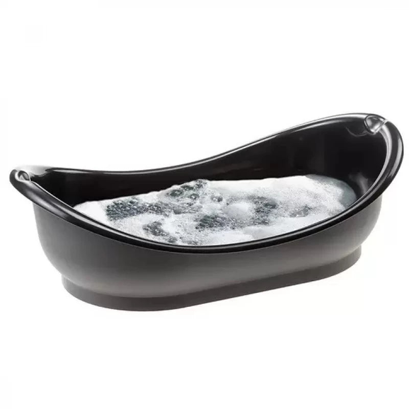 Black pet bathtub filled with water and bubbles on a white background