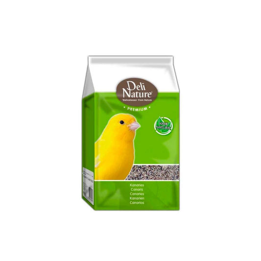 Green packaging of Deli Nature bird food with a yellow canary on a white background