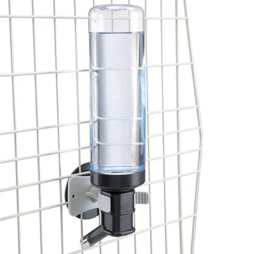 Wall-mounted dispenser with a clear container and black base on a white grid background