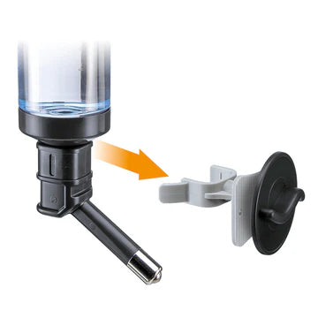 Close-up of a water dispenser with a bottle and cap on a white background