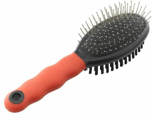 Hairbrush with red handle and black bristles on a white background