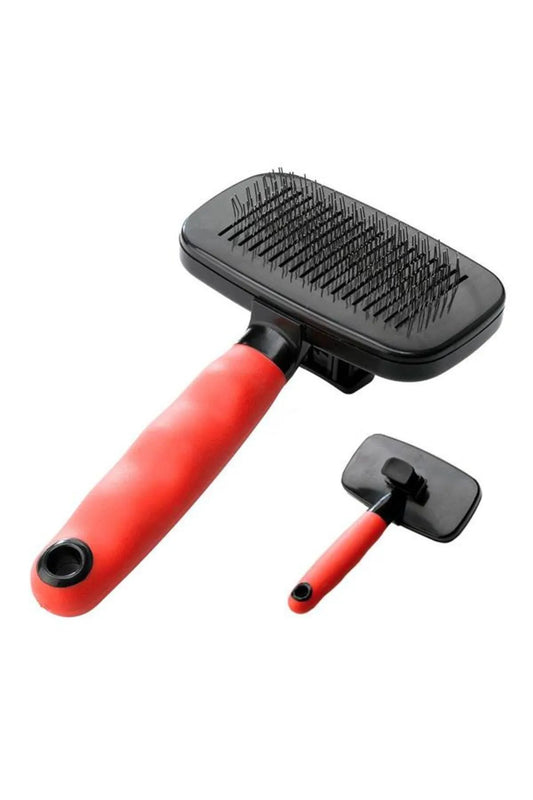 Pet grooming brush with red handle on a white background