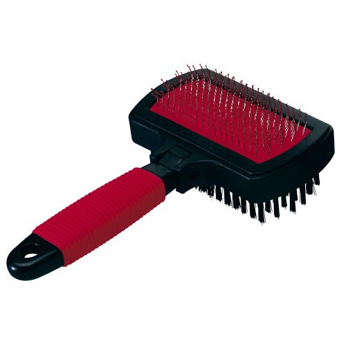 Pet grooming brush with red handle and black bristles on a white background