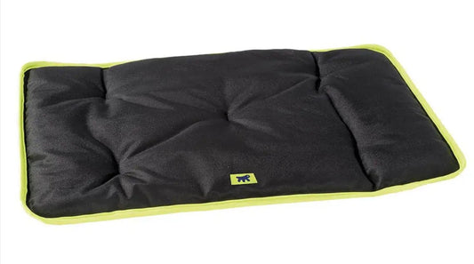 Black pet bed with green trim on a white background