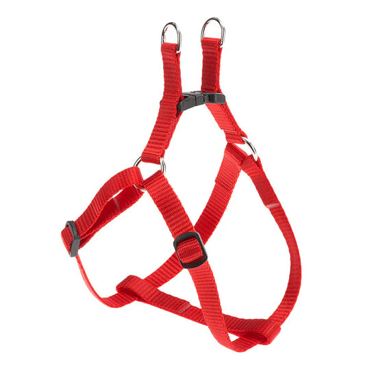 Red dog harness with black hardware on a white background
